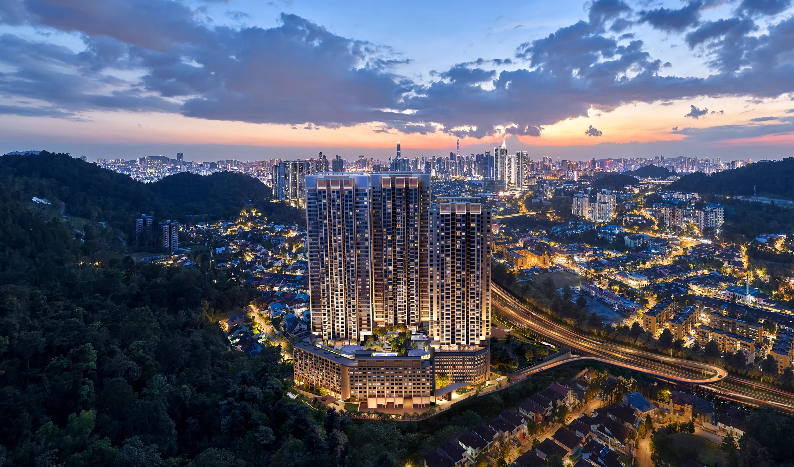 Runnymede Valley Ampang at dusk, seen from above with the Kuala Lumpur skyline beyond