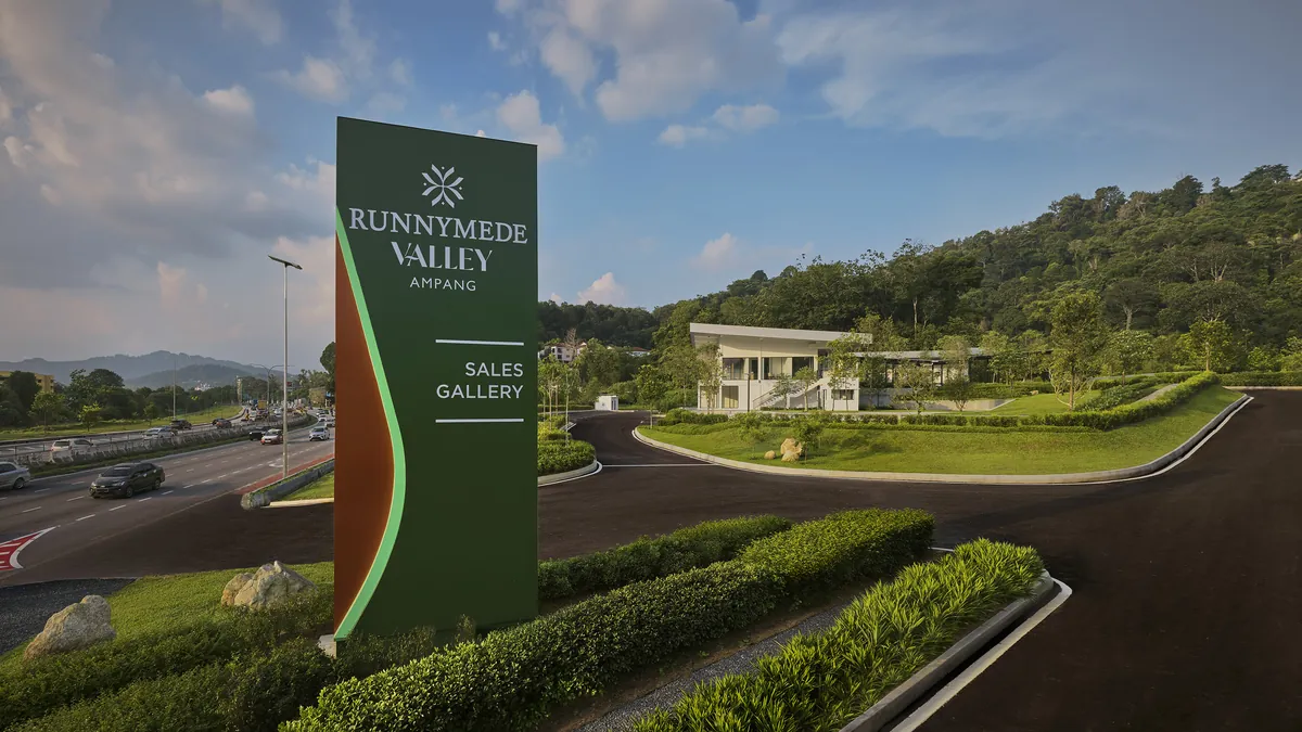 The Runnymede Valley Ampang sales gallery sign at the entrance drive