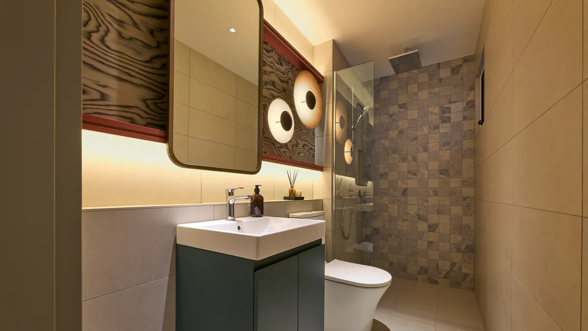Type A bathroom, round mirror and a glazed shower