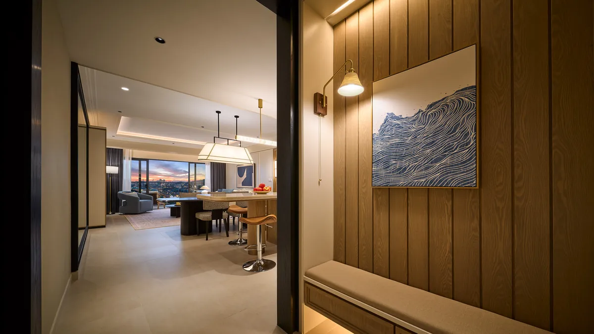 Type E foyer with timber panelling, opening onto the living room