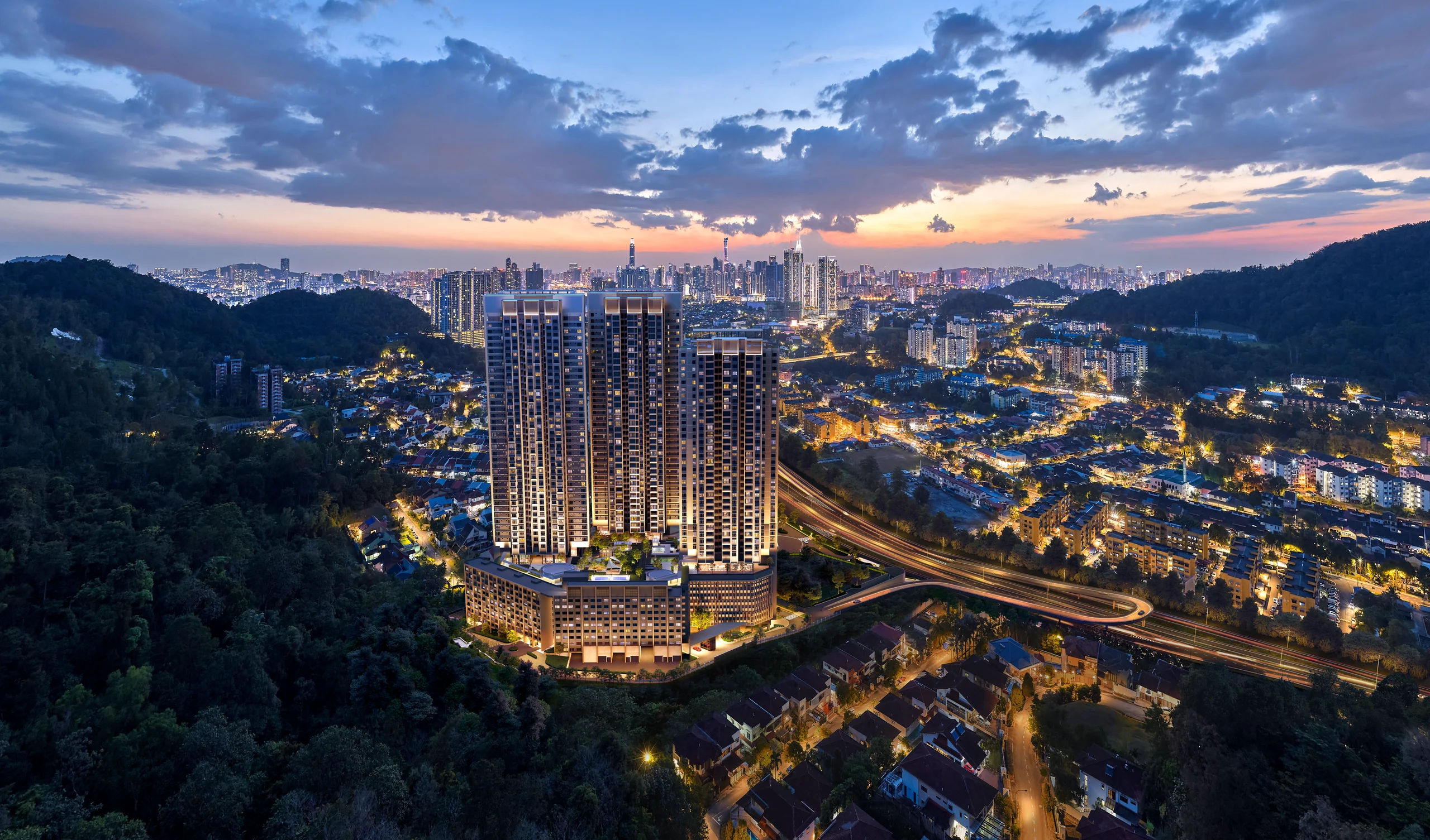 The towers at dusk above the lights of the surrounding neighbourhood